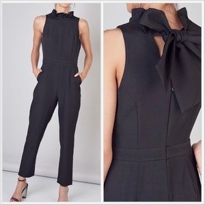 Do + Be Women’s Sleeveless Ruffle Bow Tie Neck Jumpsuit